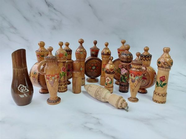 Collection of wooden bottles with the remains of perfumes and oils